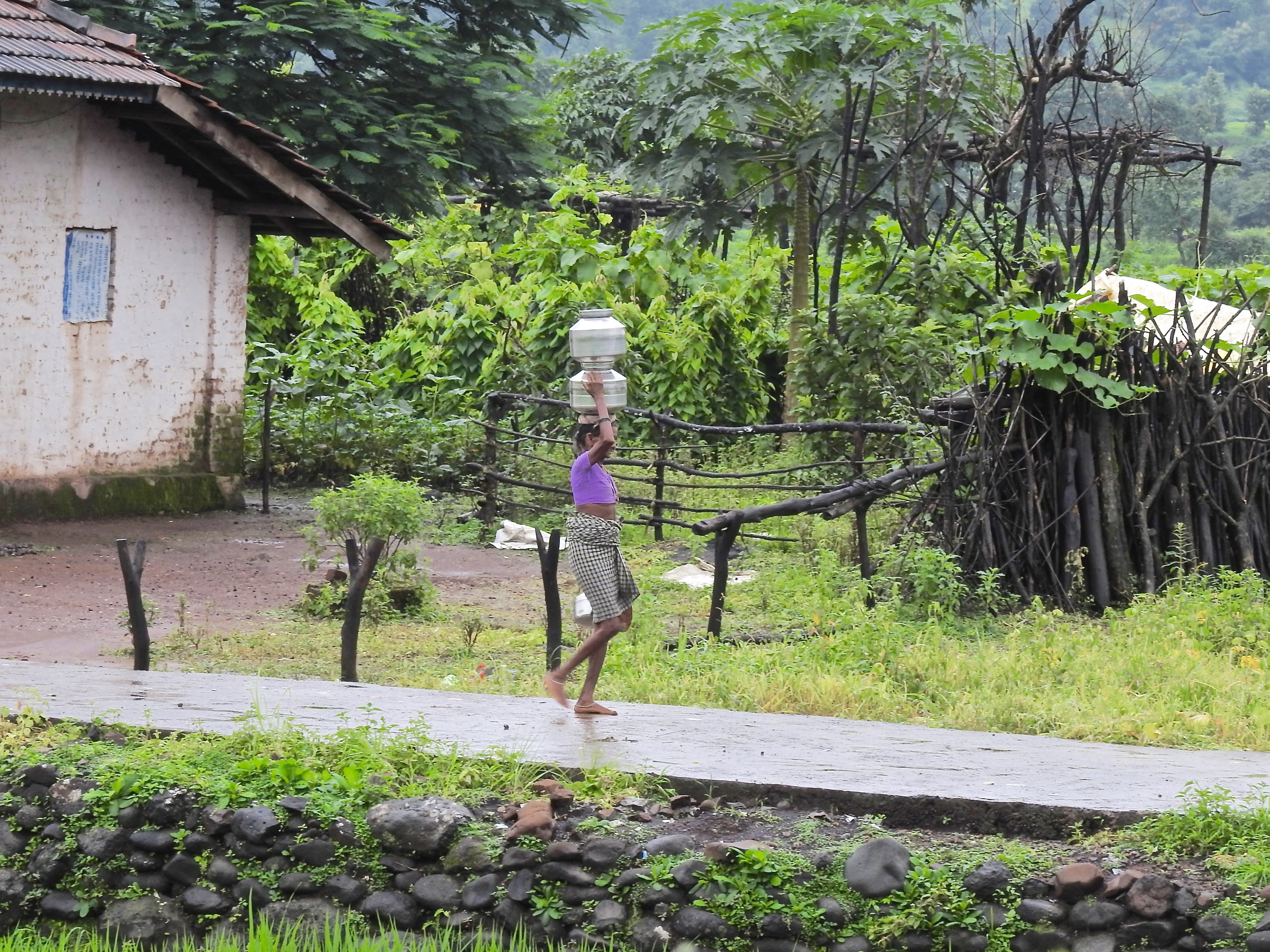 I first noticed this tribal lady as she skilfully carried two filled pots of water on her head and managed another in her hand. Imagine doing this everyday, multiple times a day – bare feet that too!