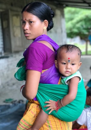 Phooleshwari, a home-based weaver, with her daughter Priyanka, at an Aagor fabric collection meeting.