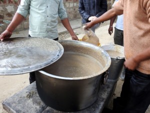 Staff at the Agra Bear Rescue Centre distribute porridge to be served to the rescued bears.