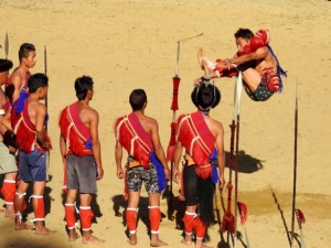 Young men from the Sumi tribe indulge in ‘Angu Kupusu’ (spear kicking). Played as a display of skill and speed, the young man who dislodges the wooden piece attached to the tip of the spear by kicking, is the winner.