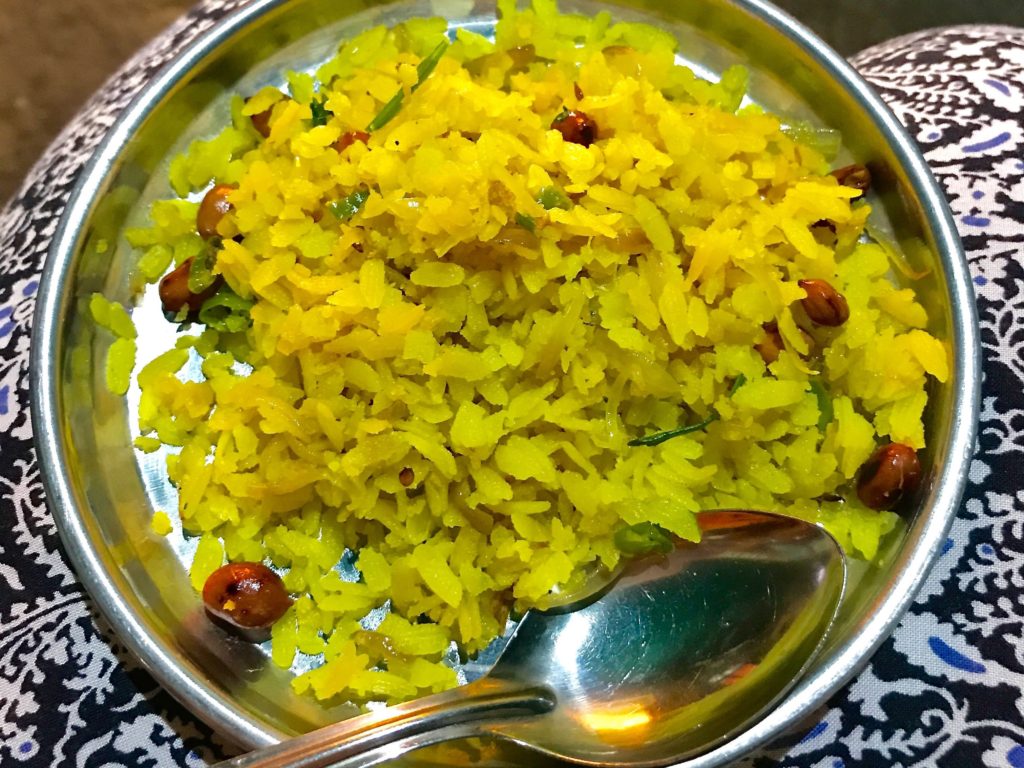 A nutritious breakfast of ‘Kande Pohe’ (rice flakes sautéed with finely chopped onions, spices & peanuts)